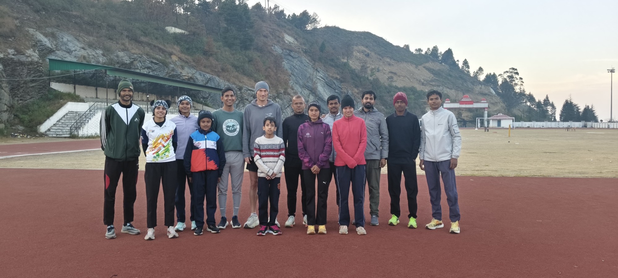 Poshak athletes and coaches on the track at the Paudi Garhwal high-altitude training camp